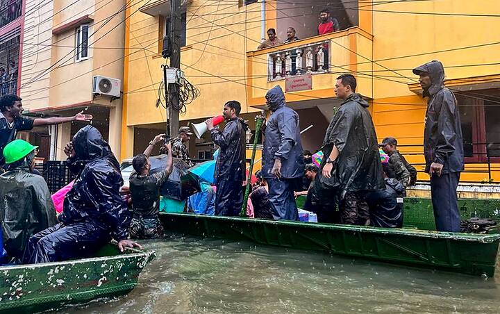 Boats crisscrossed the locality to evacuate affected people (Credit: PTI)