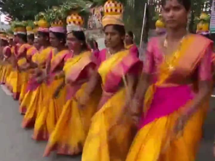Folk artists perform outside Hyderabad's LB stadium ahead of the oath-taking ceremony of Revanth Reddy as Telangana CM.