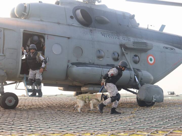 As part of Exercise Prasthan, navy personnel, accompanied by a sniffer dog, execute a descent from a helicopter onto the oil platform, preparing for scenarios involving terrorist intrusions or bomb threats. (Source: X/@IN_WNC)