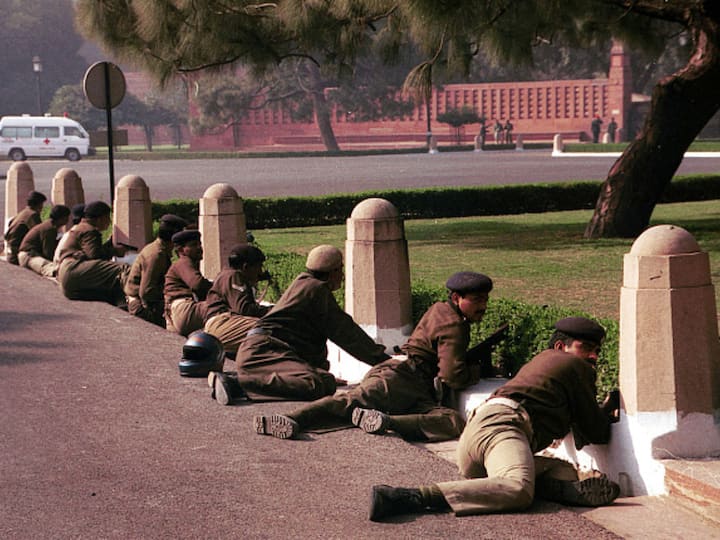 Delhi police commandos take position outside the Parliament building on December 13, 2001, after a group of armed men launched an attack on the premises. The attack resulted in the deaths of 6 Delhi Police personnel, 2 Parliament security guards, and a gardener. (Source: Getty)