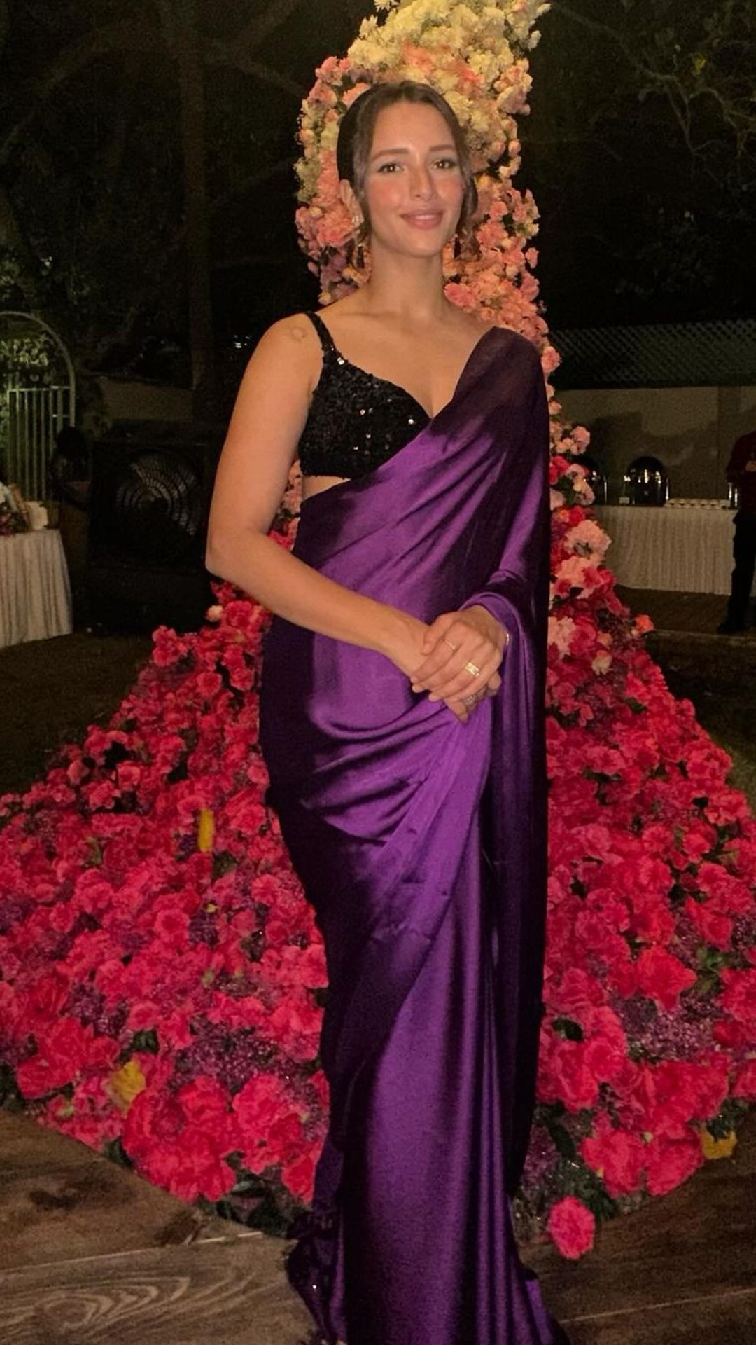 Photo of A Marathi bride in a purple saree with gold jewellery