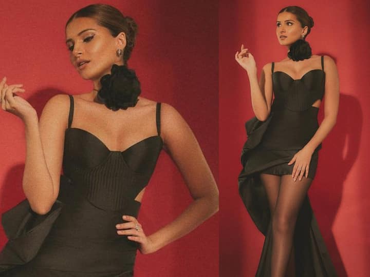 Tara Sutaria dropped glamourous pictures in a black satin dress. Check out her look.