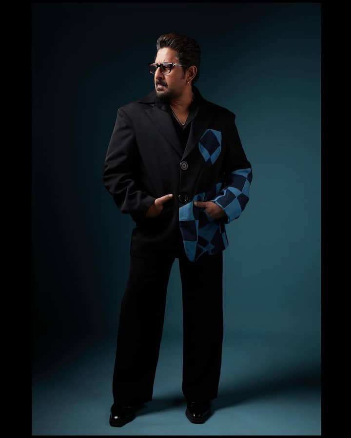 In an oversized black blazer adorned with a captivating blue and black patch print, Arshad redefines formal sophistication. (Images Source: Instagram/@arshad_warsi)