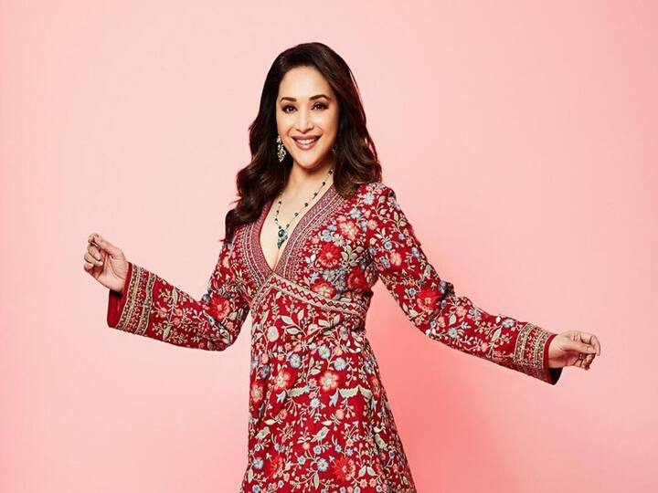 Madhuri Dixit stuns in a beautiful crimson ethnic outfit designed by renowned fashion designer Anita Dongre.