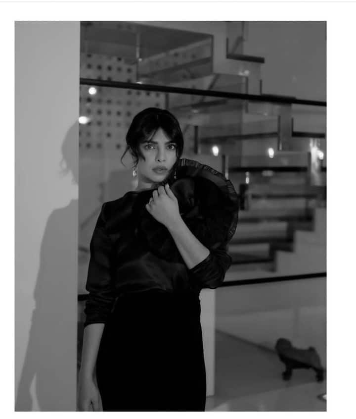 Priyanka Chopra takes center stage in a glamorous dress, beautifully accentuated by the monochrome filter. The moody atmosphere of the picture adds a touch of mystery, leaving us captivated. (Image Source: Special Arrangement)
