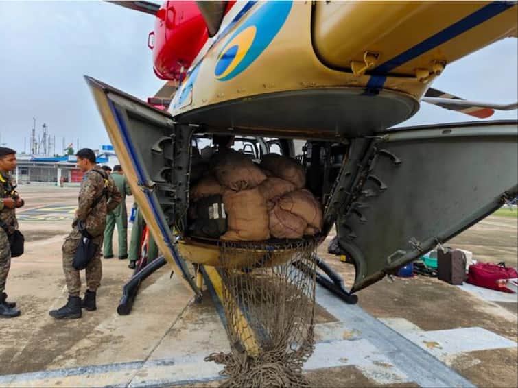 Tamil Nadu Floods IAF Chopper Airdrops Relief Material To People Cut Off By Road — Video IAF Chopper Airdrops Relief Material To People Cut Off By Floods In Tamil Nadu — Video