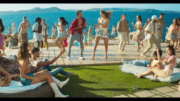 The fitted skirt features a high-rise waistline and the sleeveless top boasts an asymmetric super-cropped hem.