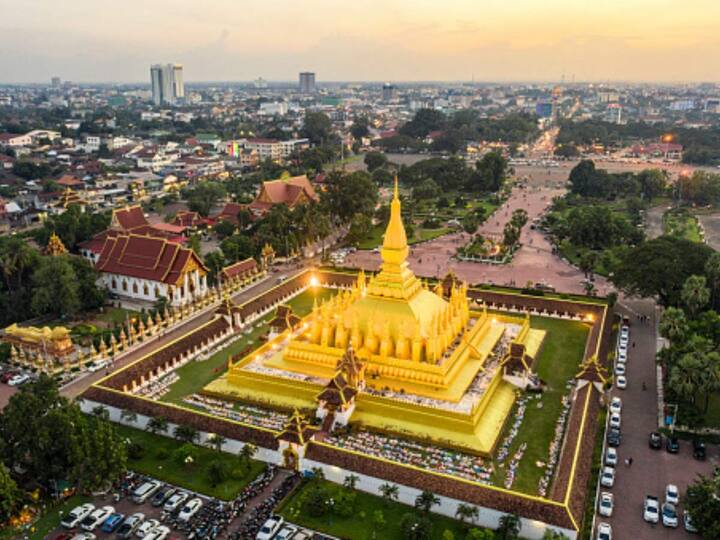 Vientiane, Laos: For a serene and beautiful New Year's Eve, Vientiane in Laos is an excellent choice. Renowned for its gold temples and historical sites, the city offers resort hotels, relaxing cafes, and quality restaurants. Don't miss the Tiger Beer Event at Nam Phou Square, featuring a countdown party with music from afternoon to midnight, complemented by colourful street decorations and delicious local street food. (Image Source: Getty Images)