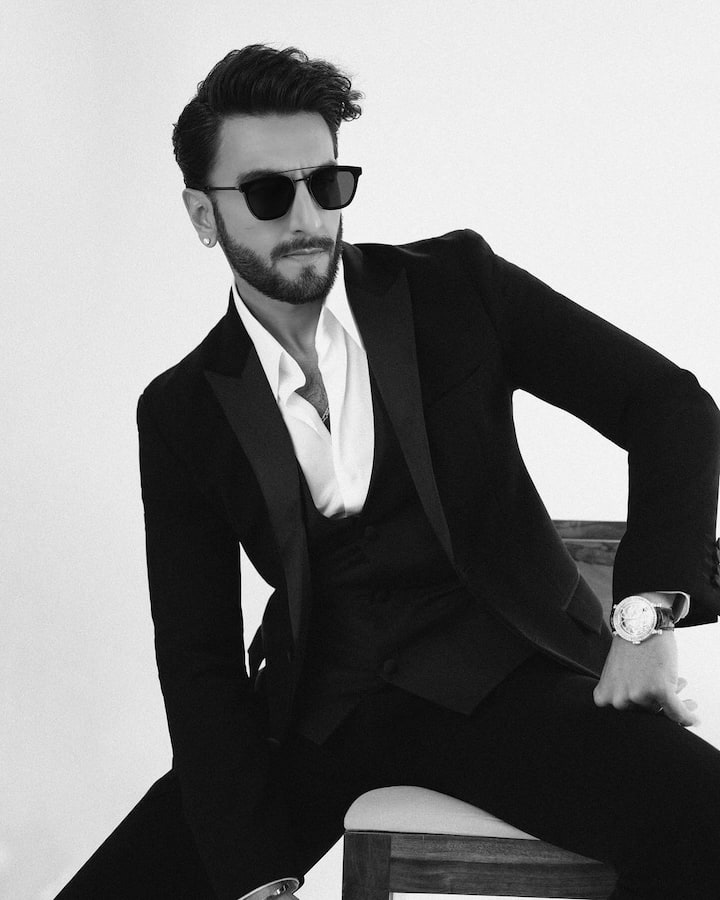 He wore black Saint Laurent sunglasses to accessorise his look.