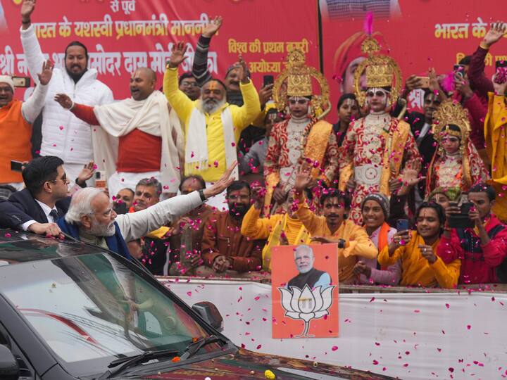 Prime Minister Narendra Modi greets people gathered to see him in Ayodhya on Saturday. (Source: PTII)