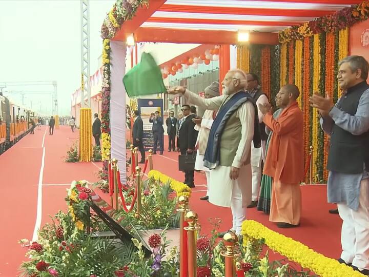 PM Modi waves the green flag to launch an Amrit Bharat train at the redeveloped Ayodhya Dham Railway Station on Saturday. (Source: YouTube@BJP4India)