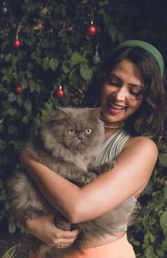 Amala Paul Poses With Cat, Flaunts Baby Bump - See Pics