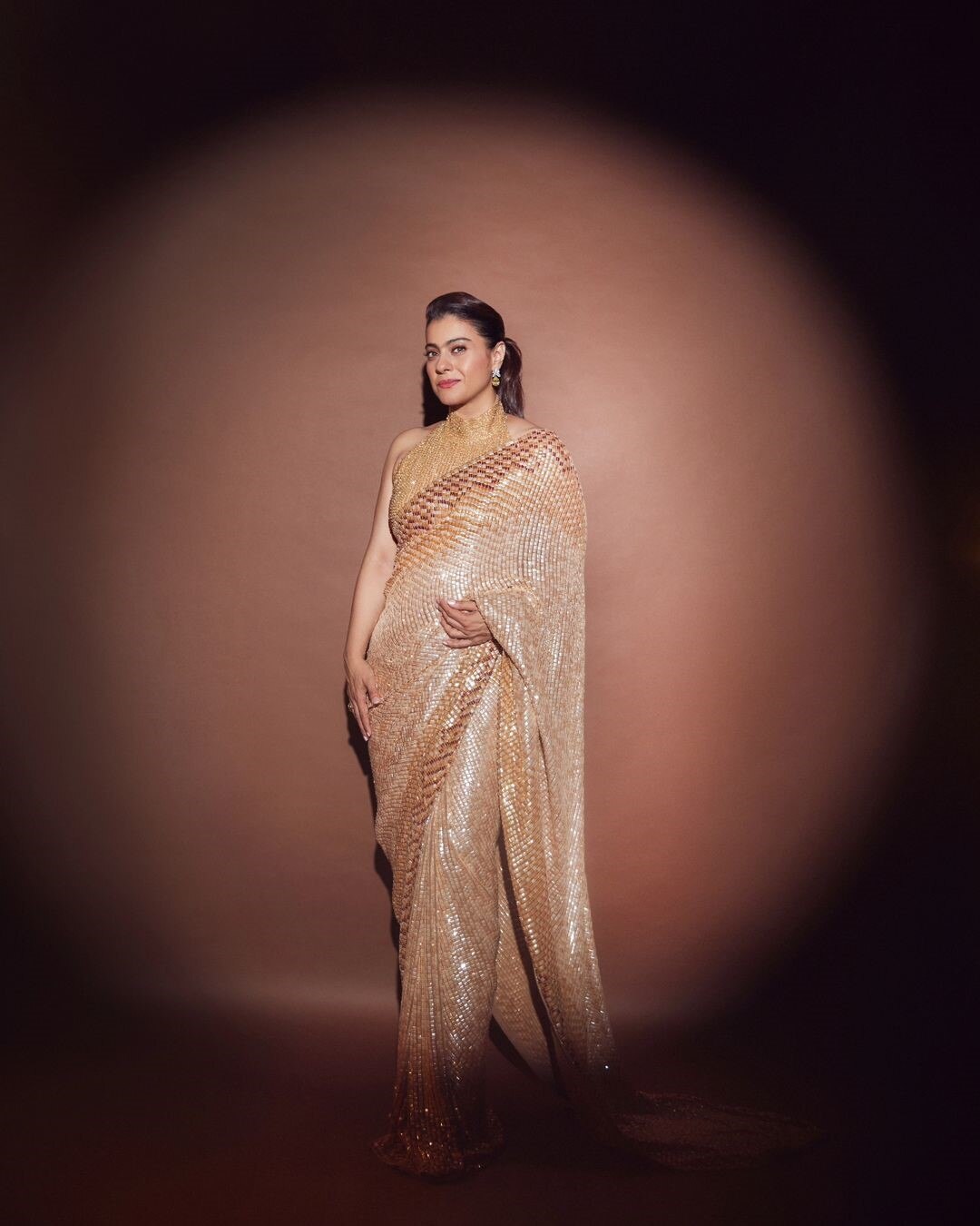 Check out Kajol's Pretty Look in a Beautiful Golden Saree with a Halter-Neck Blouse, Designed By Manish Malhotra dress
