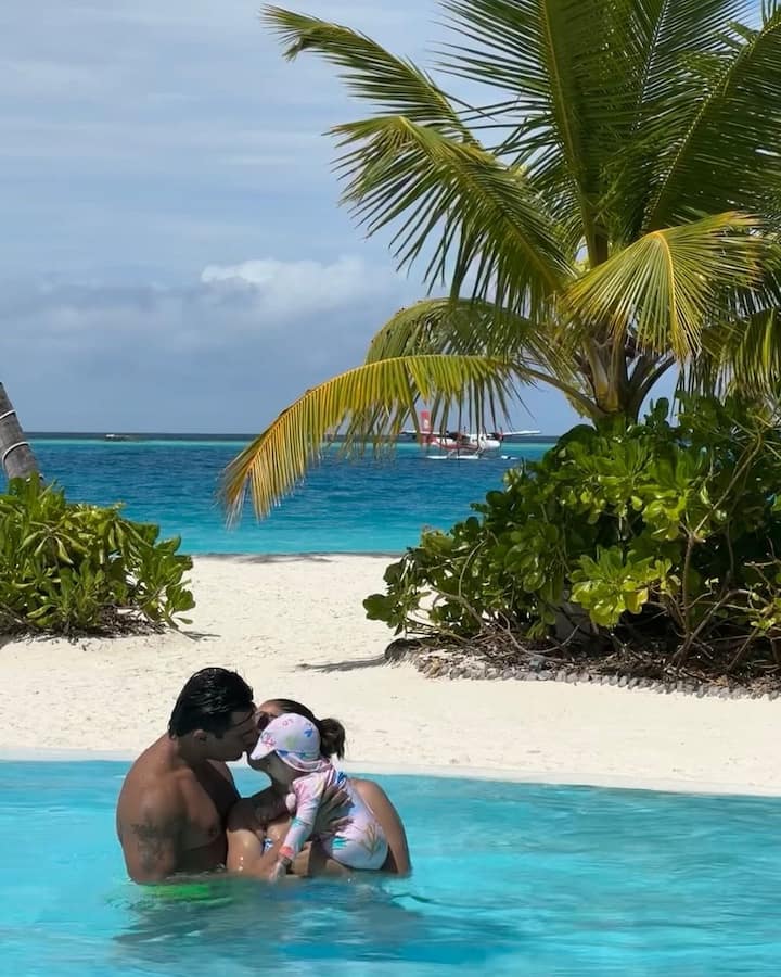 She posted the picture with her husband and daughter and wrote, 