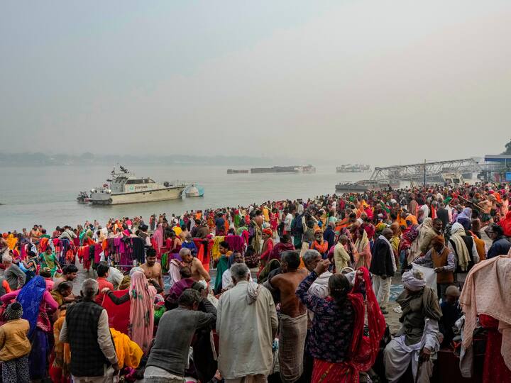 Devotees take a dip in the holy Ganga at Babughat in Kolkata.
