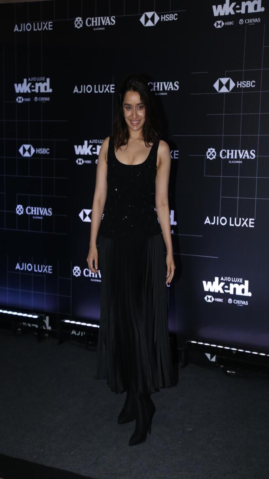 Shraddha Kapoor raises the glam bar in a black embellished top and a  pleated skirt | Times of India