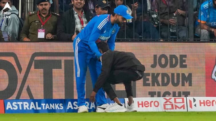 IND vs AFG T20I: Virat Kohli urges security personnel to show kindness to fan at Indore Virat Kohli: মাঠে ঢুকে প্রণাম-আলিঙ্গন ভক্তের, নিরাপত্তাকর্মীদের কী আর্জি জানালেন কোহলি?