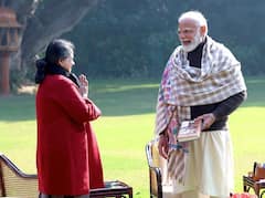 Pranab Mukherjee's Daughter Presents A Copy Of Her Book To PM Modi. IN PICS