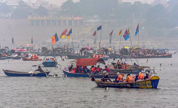Rescuers on boat patrol as devotees gather to take holy dip in the Ganga river on the occasion of Makar Sankranti festival, in Prayagraj. (Image Source: PTI)