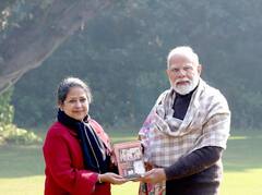 Pranab Mukherjee's Daughter Presents A Copy Of Her Book To PM Modi. IN PICS