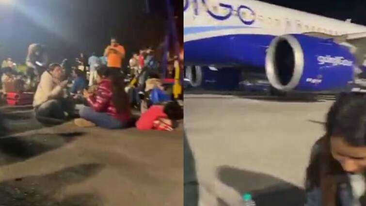 Indigo flyers 'have dinner' on Mumbai airport runway after flight delayed Video:ફ્લાઇટમાં વિલંબ થતા ઇન્ડિગો પર ભડક્યા મુસાફરો, રનવે પર બેસી જમવા લાગ્યા