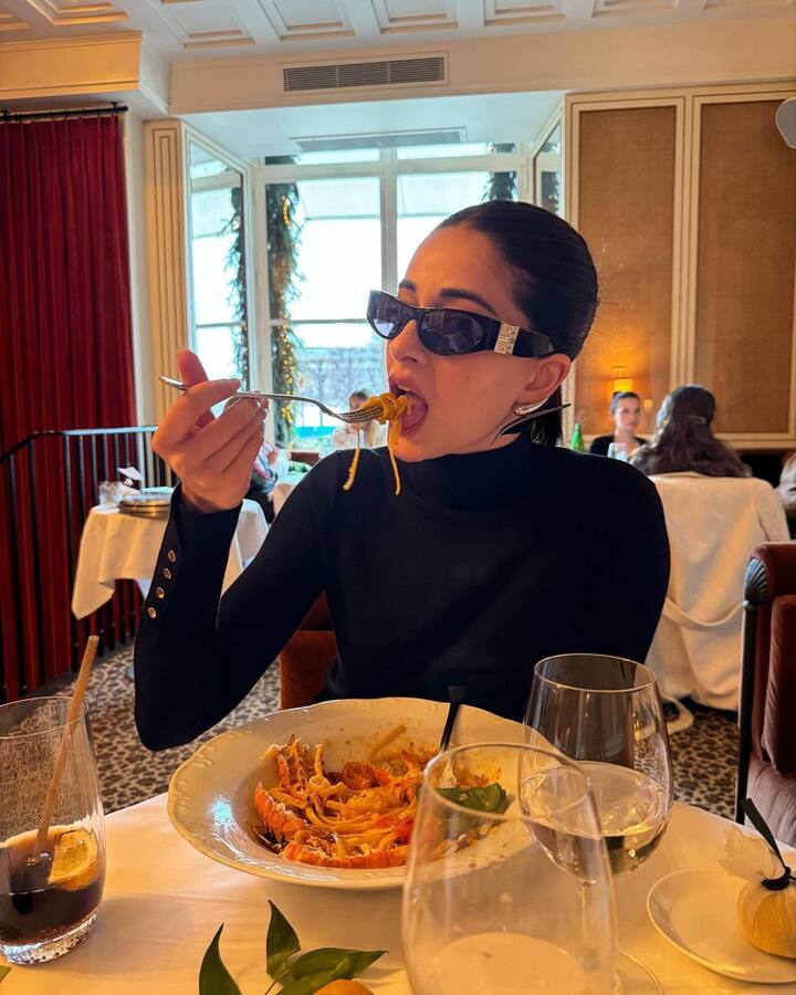 She rounded up her look with a sleek hair bun and black high heels.