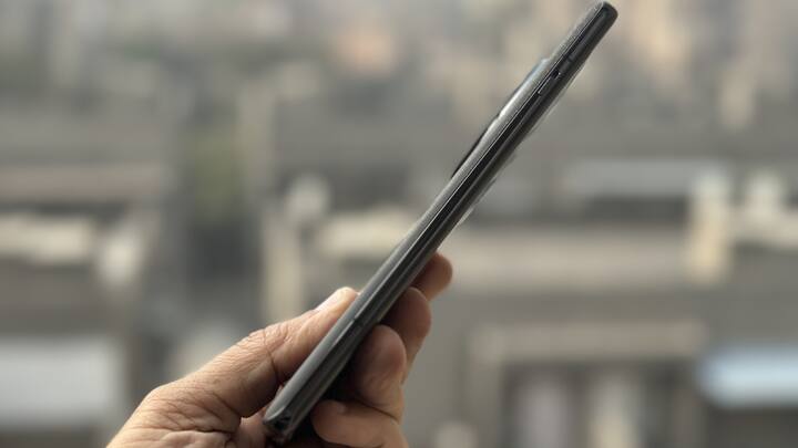 Looks Elegant, And Ever So Familiar — It is elegant, but the OnePlus 12 5G can be mistaken for the OnePlus 11 5G, especially the black variant (go for the Flowy Emerald, if you want a OnePlus that looks different). It is bigger and heavier (220g) than the OnePlus 11 5G, but the design basics are the same — curved display in front, aluminium frame, and glass back with a large, dark circular camera unit. There's no talk of titanium (praise be), but this is a tough phone with Gorilla Glass Victus 2 in front, Gorilla Glass on the back, and IP65 dust and water resistance — up from IP64 on the OnePlus 11, but still short of the IP68 on the iPhone.