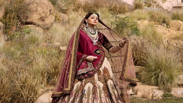 Nargis Fakhri Bridal Photoshoot: 'રોકસ્ટાર' ફેમ એક્ટ્રેસ નરગીસ ફખરીએ હાલમાં જ પોતાનો બ્રાઈડલ લૂક ફોટોશૂટ શેર કર્યું છે. આ લુકમાં નરગીસ ફખરી ખૂબ જ સુંદર લાગી રહી છે.