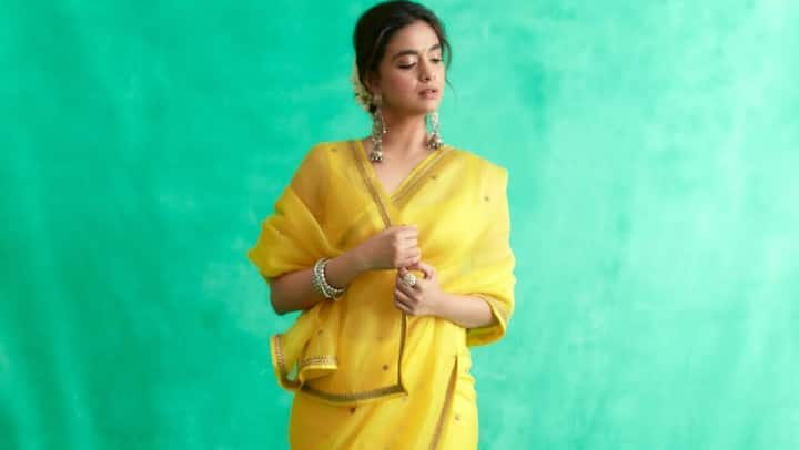 Keerthy Suresh treated fans with pictures in a yellow saree looking her elegant best; check out pics