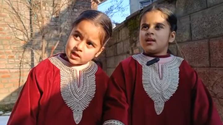 Jammu Kashmir two girls reporting Viral Video snowfall video goes viral ANN Kashmir Little Girls Reporting: कश्मीर में बर्फबारी के बीच दो बच्चियों ने की रिपोर्टिंग, नटखट अंदाज में खूबसूरती को किया बयां