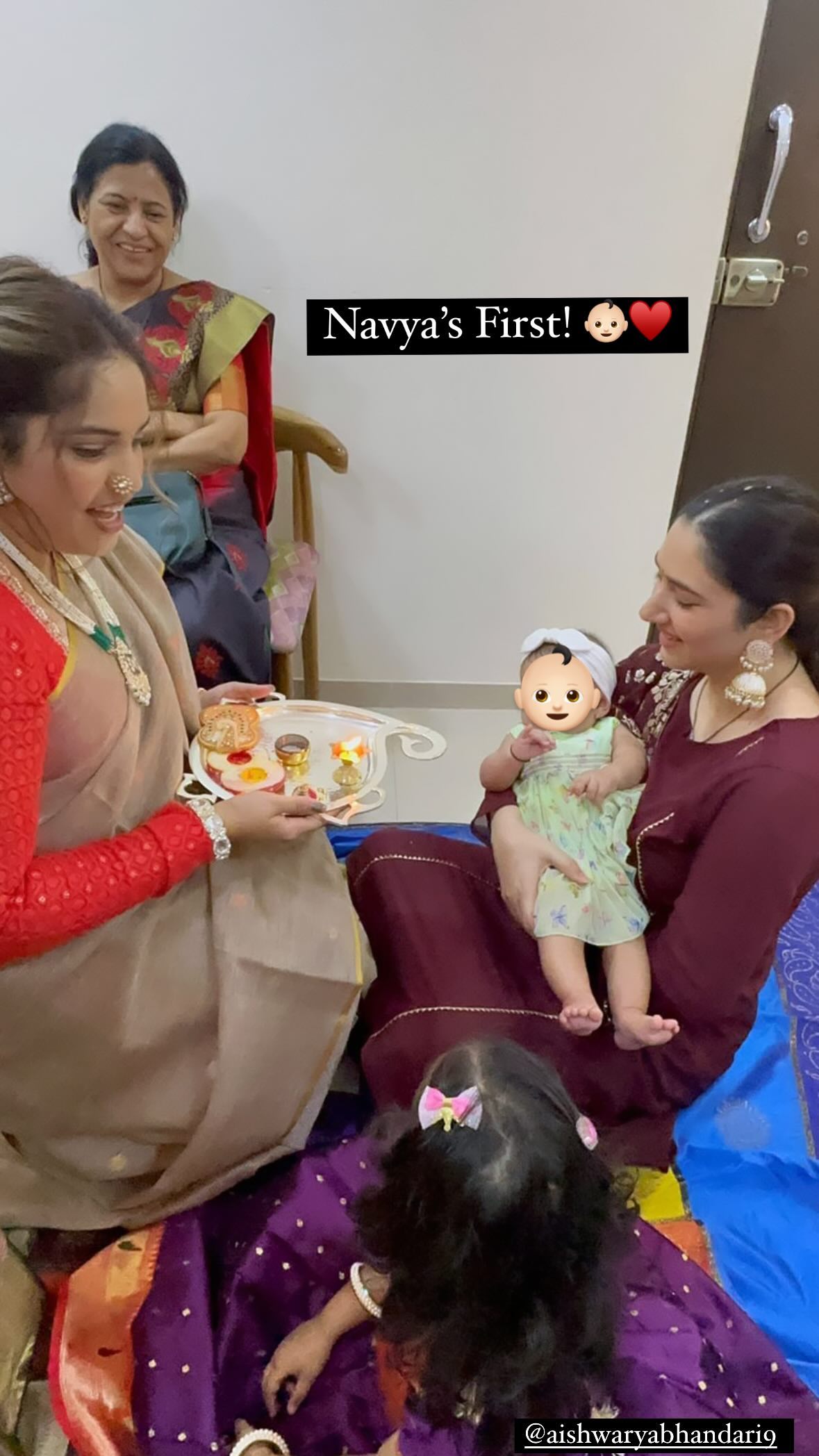 Disha Parmar's first traditional look with her daughter, wearing haldi kumkum, wine suit and earrings.
