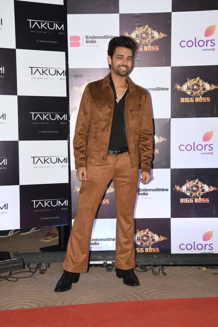 Samart Jurel in a brown pant suit