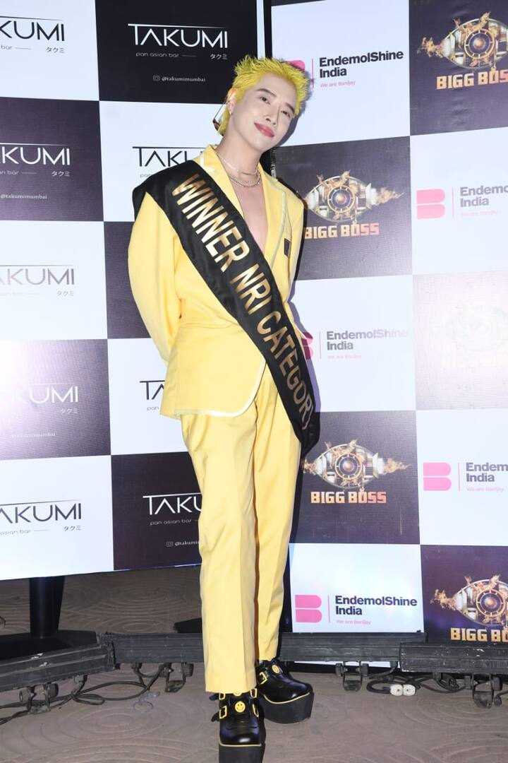 Korean Singer Aoora in a yellow pant suit
