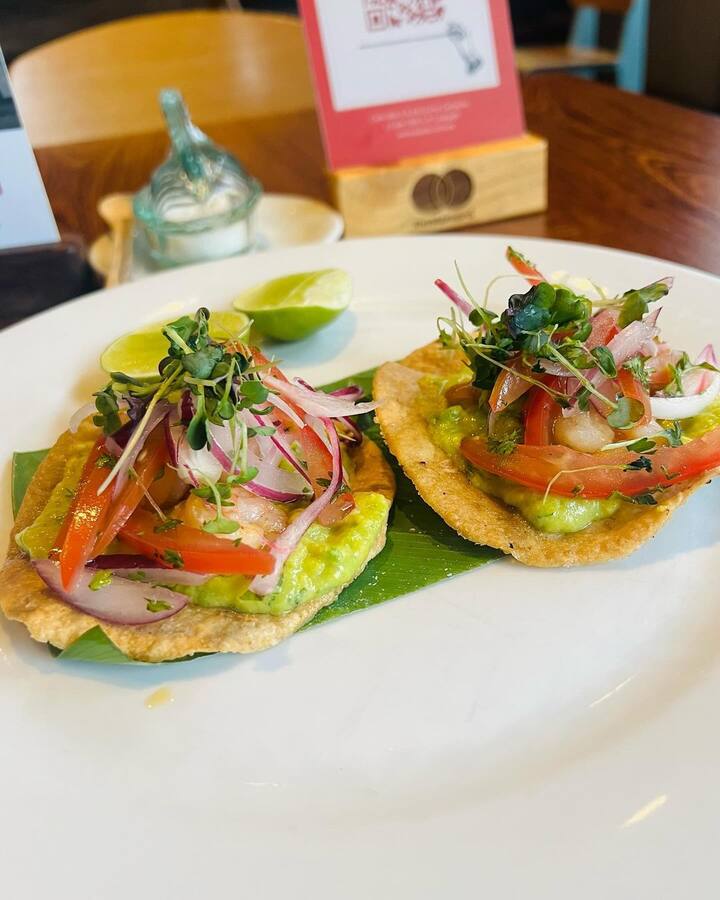The string of photos shows a cup of coffee, and a picture of Envueltos de mazorca, which is a corn preparation wrapped in leaf.