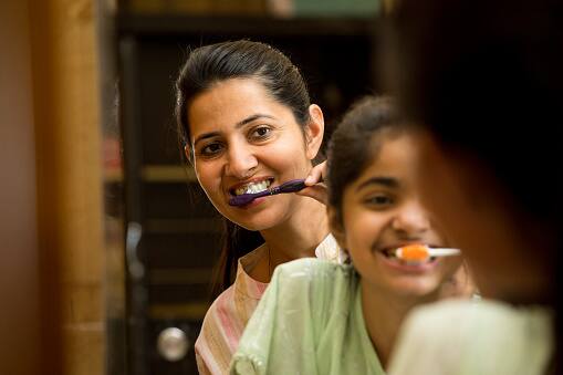 Chew Gum or Brush Your Teeth:Keep your mouth busy with sugar-free gum or by brushing your teeth after meals. This can signal the end of eating, making it less tempting to reach for additional snacks. (Image Source: Getty)