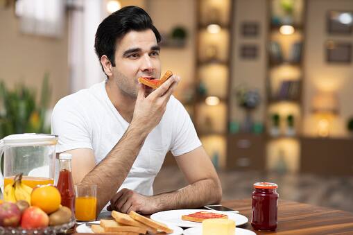Slow Down: Enjoy your meal by slowing down the pace of your eating. It takes about 20 minutes for your brain to register fullness, so taking your time can help prevent overeating. (Image Source: Getty)