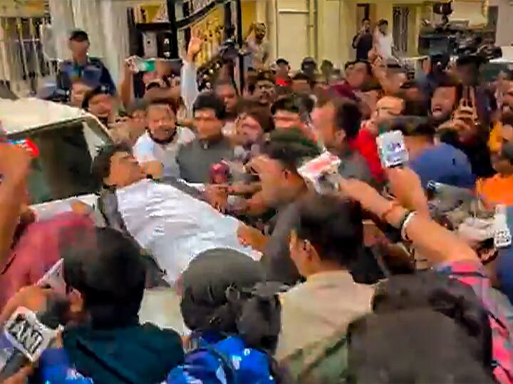 BJP President Sukanta Majumdar falls on the bonnet of a car amid Sandeshkhali protest, in North 24 Parganas district on Wednesday. (Photo:PTI)