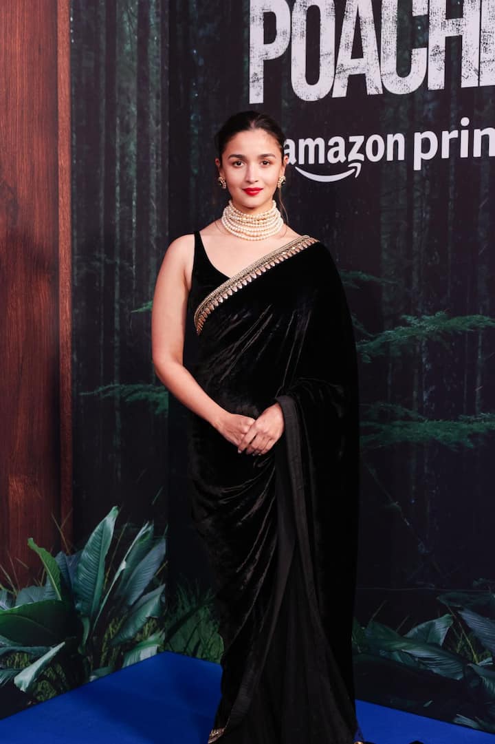 Alia Bhatt looked like a superstar in a black velvet saree paired with a matching sleeveless blouse, pearl jewellery and bold red lips.