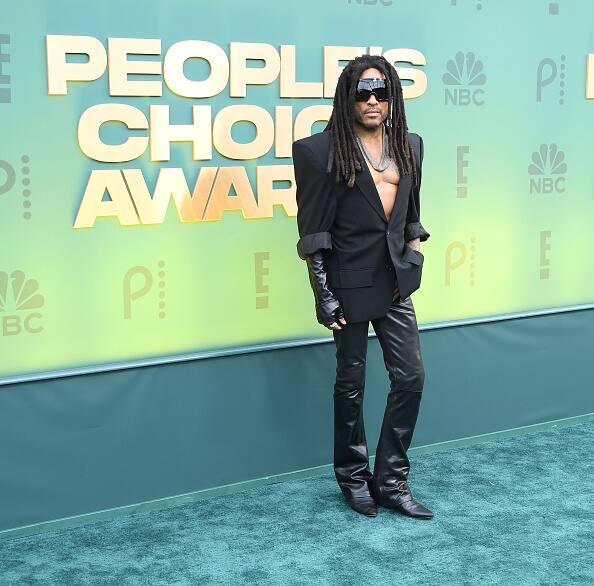 Lenny Kravitz opted for slim-fit black leather pants and a structured black blazer.