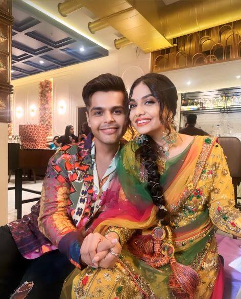 She looked beautiful in a yellow and green suit with red sharara.