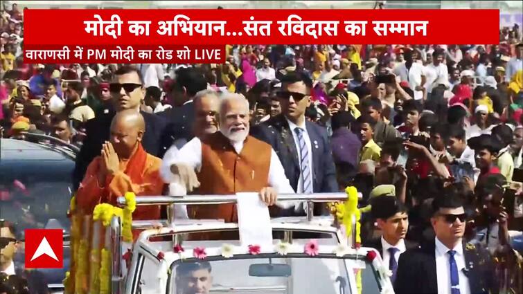 PM Modi holds a grand highway present in Varanasi, crowd showers flower on the PM Modi, watch | ABP Information