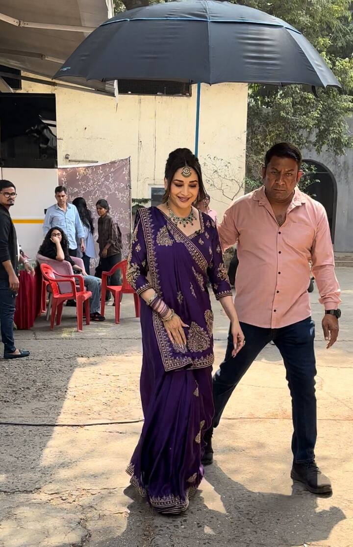 She paired her ensemble with a diamond and emerald necklace, a purple bangle stack, emerald rings, and a matching maang-teeka.