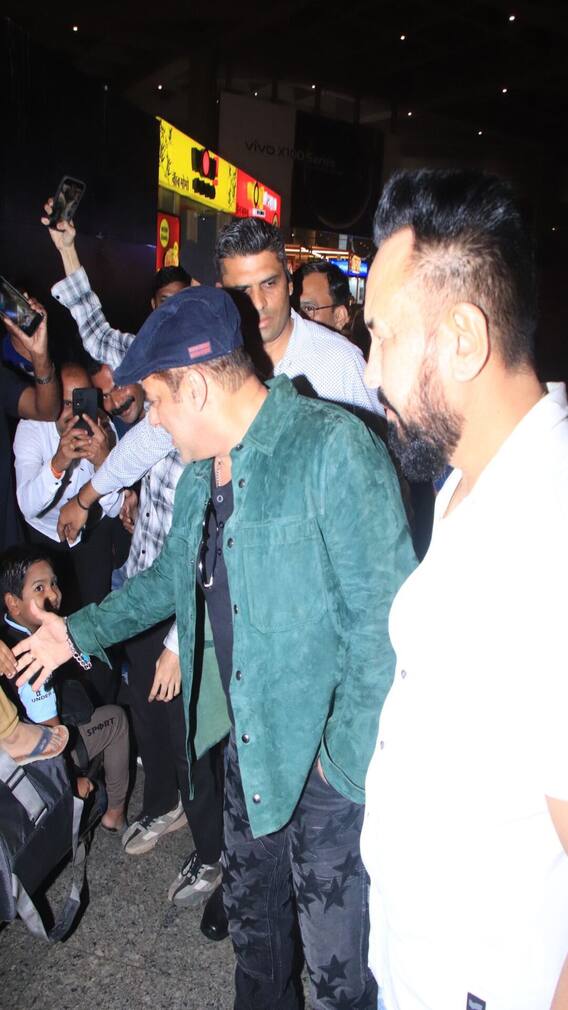 Salman Khan Greets Young Fans At Mumbai Airport