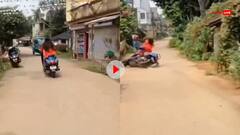 Video: 'धूम' स्टाइल में लड़की ने लगाई रेस, बैलेंस बिगड़ा और बीच सड़क पर गिरी स्कूटी, फिर जो हुआ...