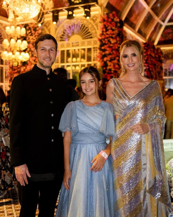 Ivanka Trump dazzles in Indian attire at the grand pre-wedding festivities in Jamnagar, turning heads in a stunning silver-gold saree by Manish Malhotra. Her minimalistic yet elegant accessories and dewy-rosy makeup perfectly complement her desi allure. (Image source: Manav Manglani)
