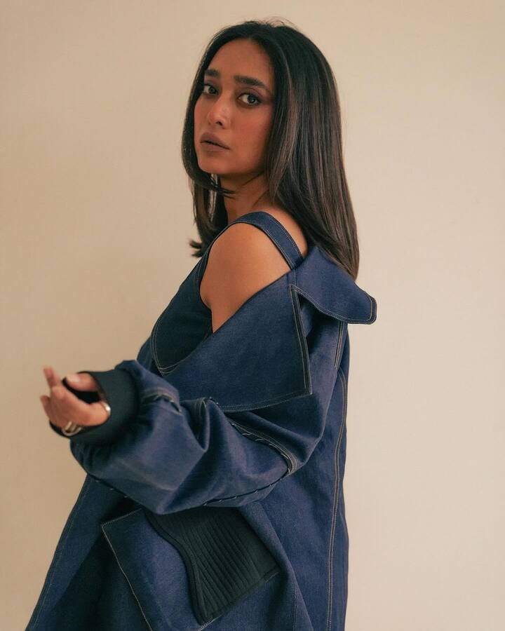 The look was completed with denim stilettos, and a small golden handbag.
