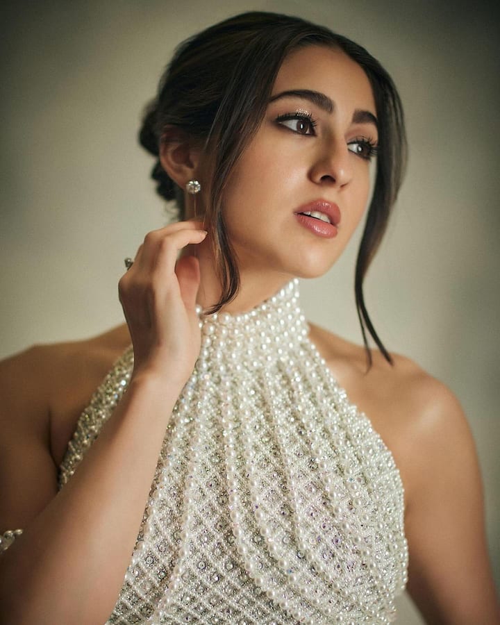 Sara Ali Khan Is A Vision To Behold In A White Pearl Lehenga; See PICS