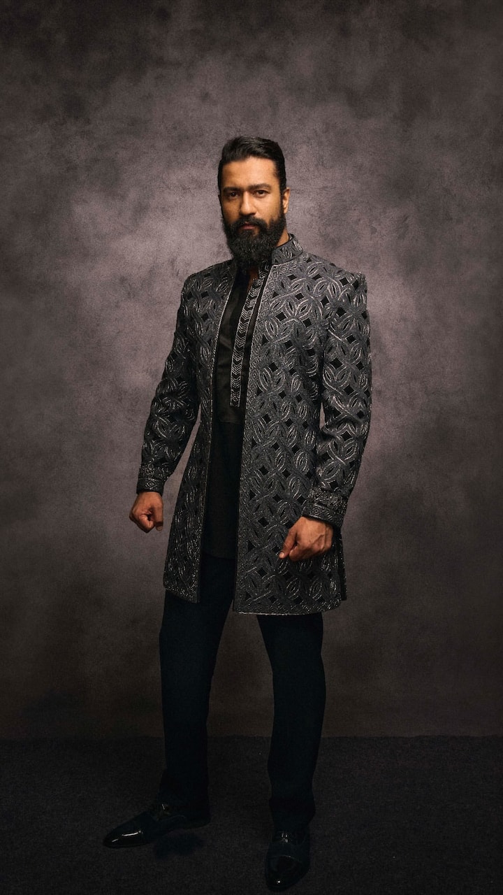 Vicky exuded charm in a dashing grey-silver sherwani.