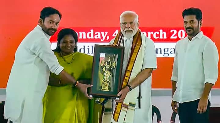 PM Modi being felicitated by Union Minister G Kishan Reddy during the launch of development initiatives, in Adilabad, Telangana. Telangana Governor Tamilisai Soundararajan, Chief Minister A Revanth Reddy are also present. (Photo: PTI)