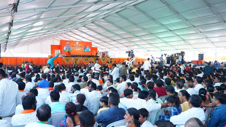 The audience waits for PM Modi at Indira Priyadarshini Stadium, Adilabad ahead of his address. (Photo: X/@BJP4Telangana)